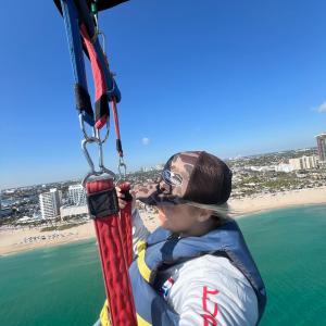 a person standing next to a body of water