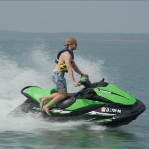a man riding a wave on a surfboard in the water