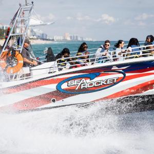a group of people on a boat in the water
