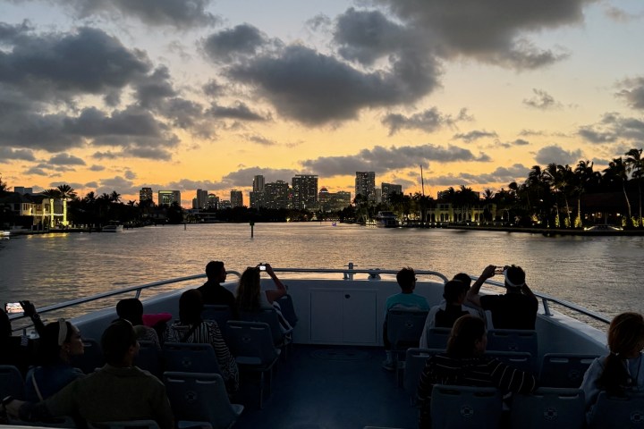 a group of people in a boat on a body of water
