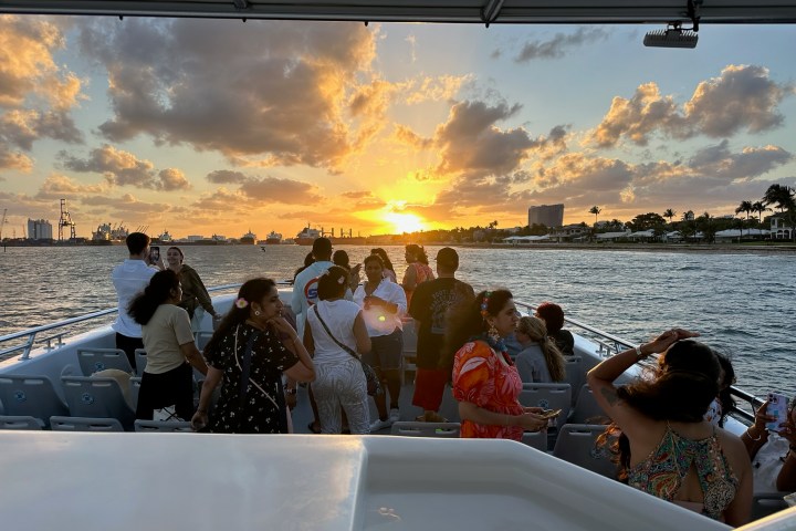 a group of people riding on the back of a boat