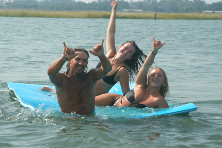a group of people swimming in a body of water