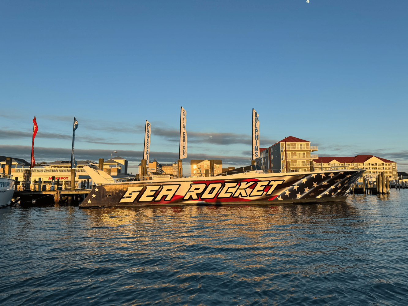 a boat is docked next to a body of water