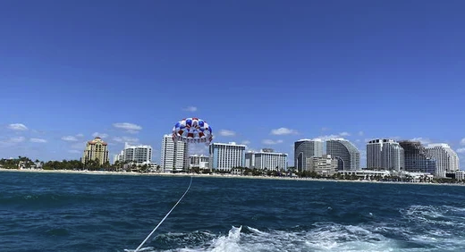 a large body of water with a city in the background