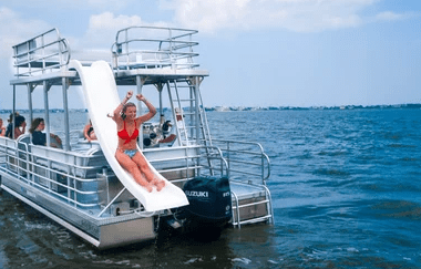 a group of people in a small boat in a body of water