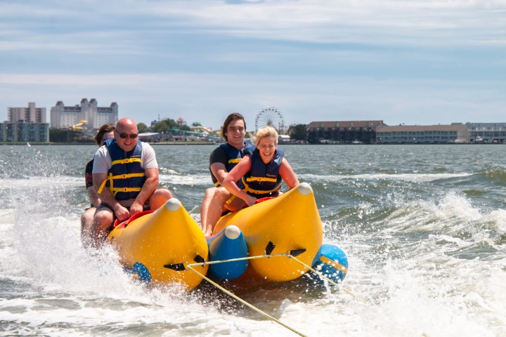 a man riding on a raft in a body of water