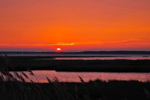 a sunset over a body of water