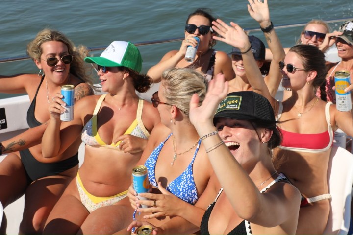 a couple of people that are standing in the water