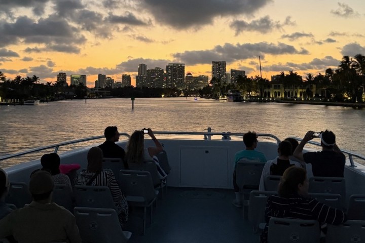 a body of water with a city in the background