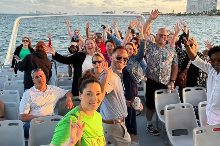 a group of people on a boat in the water
