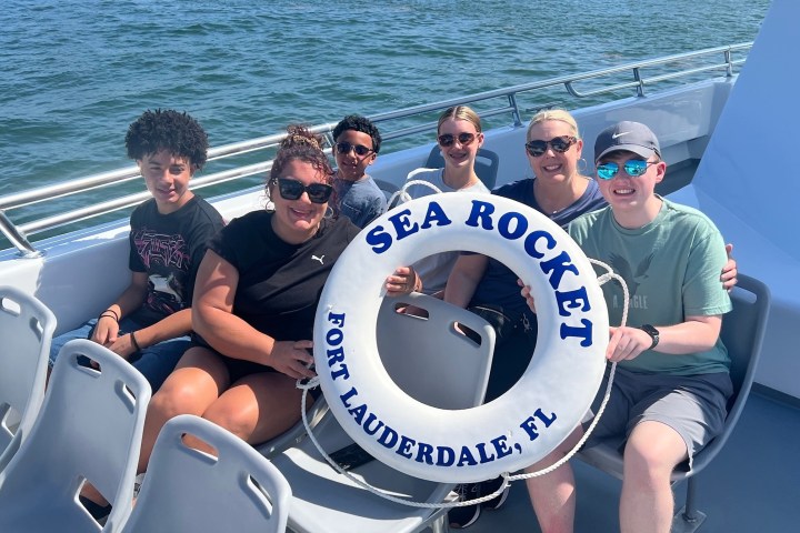 a man sitting on a boat in the water