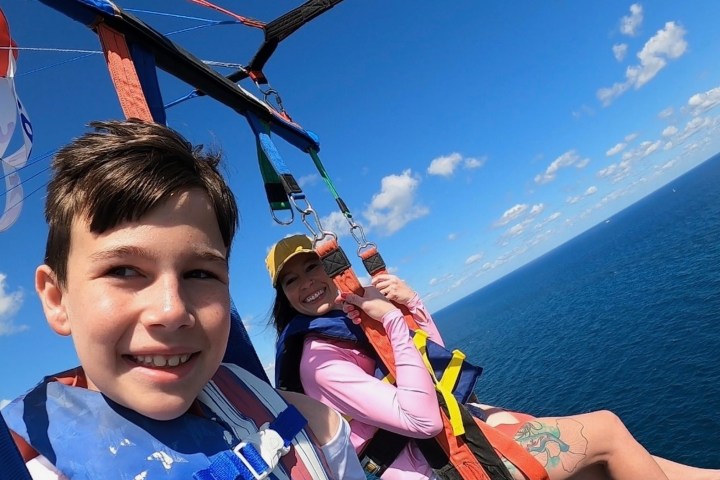 a group of people in a boat on a body of water