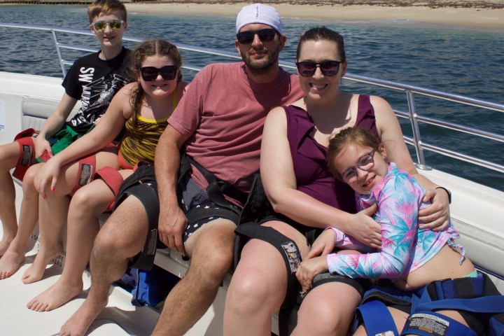 a couple of people that are sitting on a boat