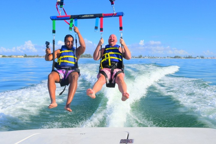 a person riding a surf board on a body of water