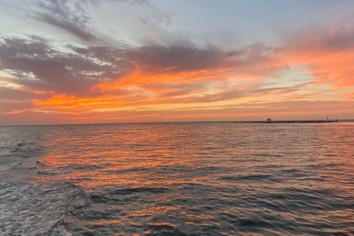 a sunset over a body of water