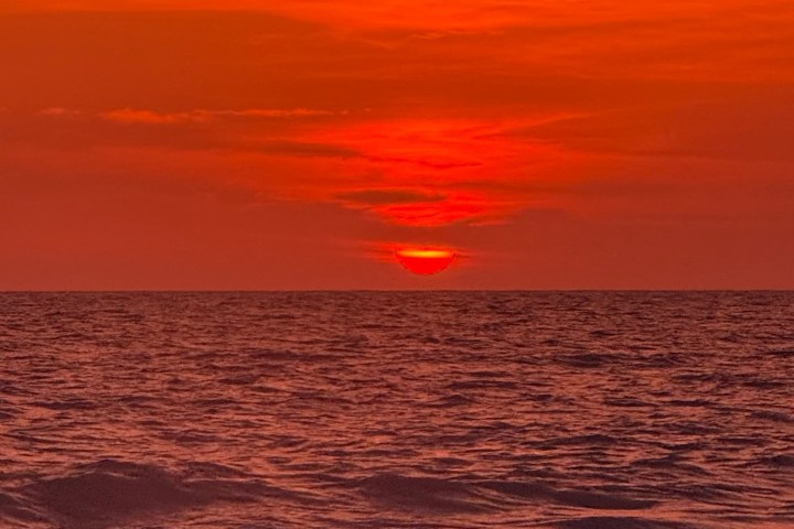 a sunset over a body of water