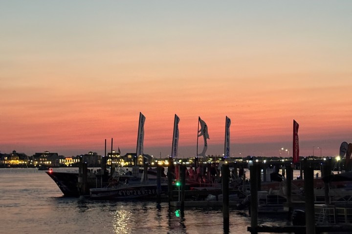 a close up of a pier next to a body of water