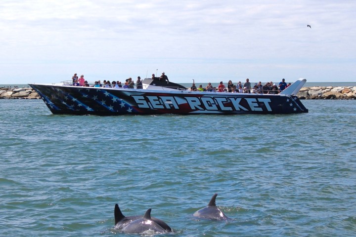 a group of people in a boat on a body of water