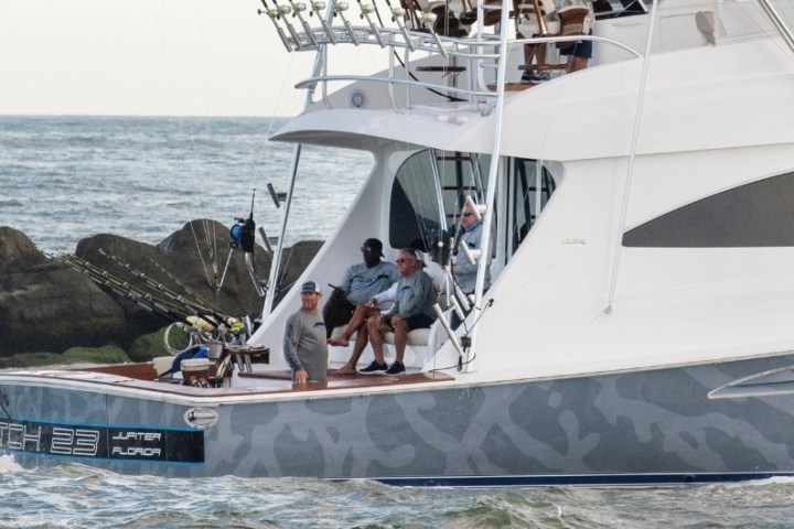 a group of people on a boat in the water