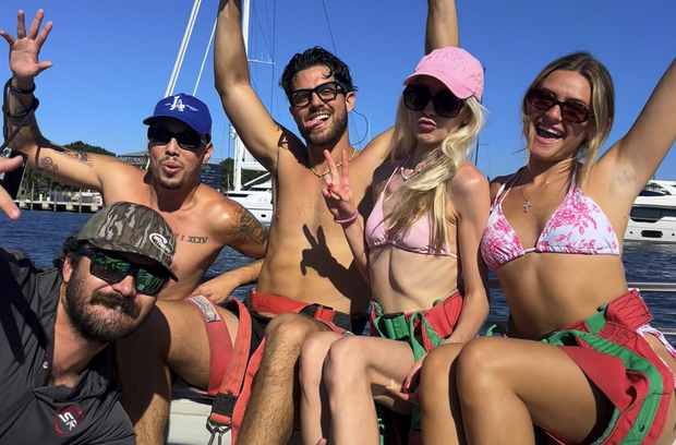 Group of people on boat getting ready to parasail
