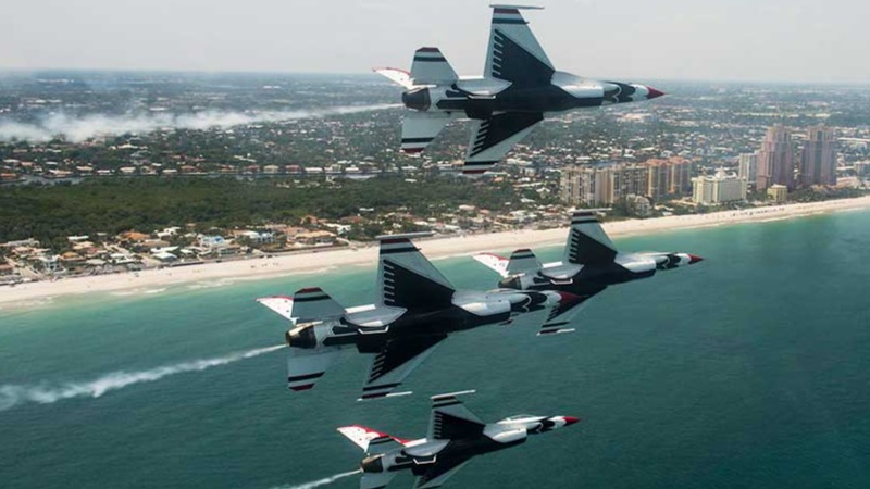 U.S. Air Force Thunderbirds performing at the Fort Lauderdale Air Show with ocean below